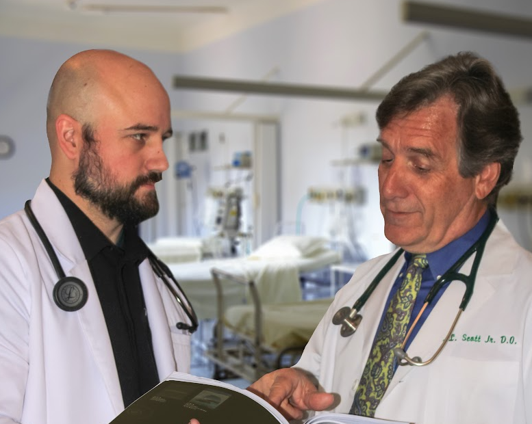 Dr. Scott and another doctor talking about medical realted elements.